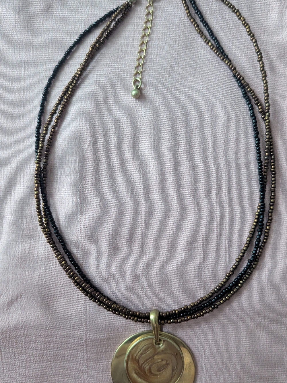 Multi-Strand Black and Bronze Beaded Necklace with Gold Pendant